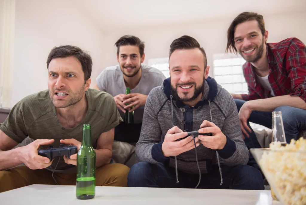 friends drinking beer playing videogames
