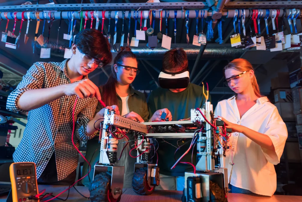 Competition Engineering Skills and Real Use Cases 2 group teens doing experiments robotics laboratory boys girls protective vr 1